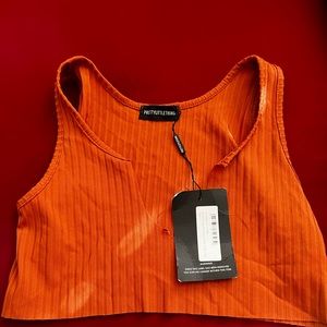 Burnt orange V neck crop top. Size small